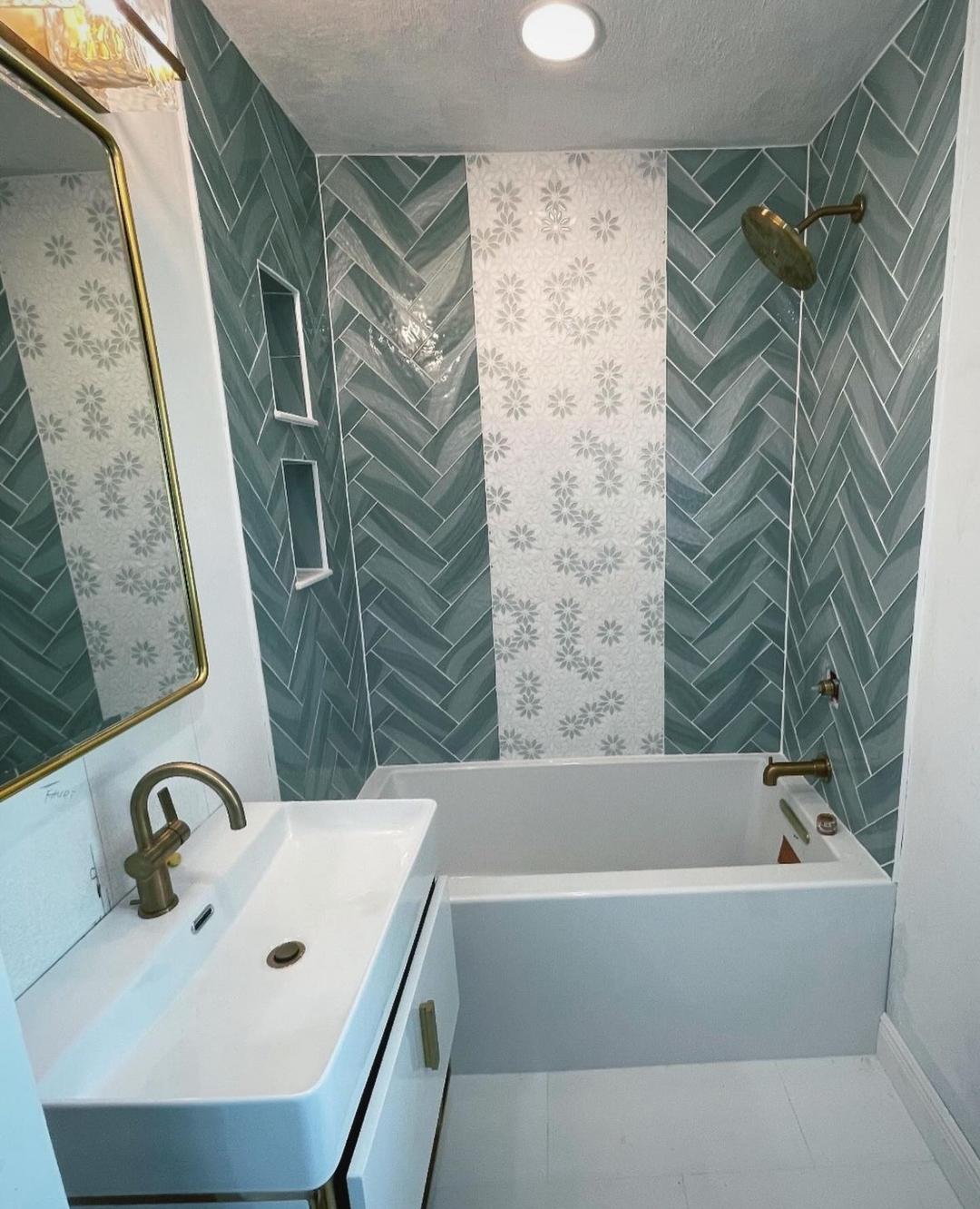 Teal herringbone tile bathroom